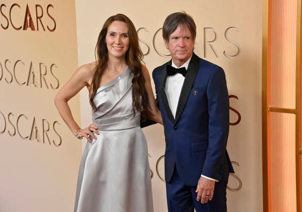 Laura Stabilini and Paul Cameron arrive on the red carpet for the 98th annual Academy Awards in the Hollywood section of Los Angeles on Sunday, March 15, 2026. Conan O Brien will host the Oscars for the second consecutive year.  LAP20260315313 JIMxRUYMEN