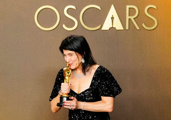 Cassandra Kulukundis celebrates in the press photo room after winning the Best Casting Oscar for One Battle After Another during the 98th annual Academy Awards in the Hollywood section of Los Angeles on Sunday, March 15, 2026. Conan O Brien is hosting the Oscars for the second consecutive year.  LAP20260315334 BONNIExCASH