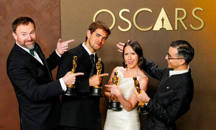 Natalie Musteata and Alexander Singh celebrate in the press photo room after winning the Best Live Action Short Film Oscar for Two People Exchanging Saliva during a tie with Sam A. Davis and Jack Piatt for The Singer in the 98th annual Academy Awards in the Hollywood section of Los Angeles on Sunday, March 15, 2026. Conan O Brien is hosting the Oscars for the second consecutive year.  LAP20260315361 BONNIExCASH