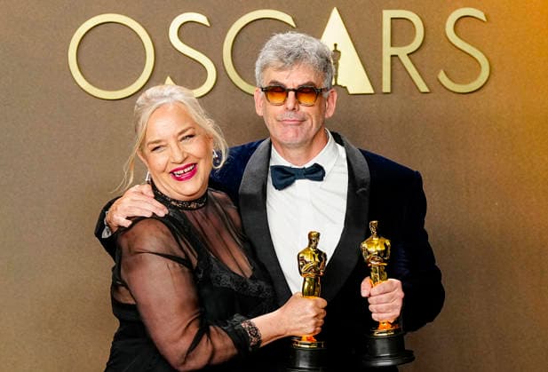 Tamara Deverell and Shane Vieau celebrate in the press photo room after winning the Best Production Design Oscar for Frankenstein during the 98th annual Academy Awards in the Hollywood section of Los Angeles on Sunday, March 15, 2026.  LAP20260315367 BONNIExCASH