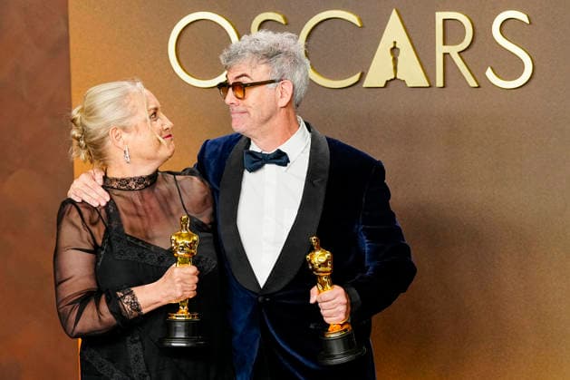 Tamara Deverell and Shane Vieau celebrate in the press photo room after winning the Best Production Design Oscar for Frankenstein during the 98th annual Academy Awards in the Hollywood section of Los Angeles on Sunday, March 15, 2026.  LAP20260315368 BONNIExCASH
