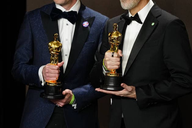 Conall Jones and Joshua Seftel celebrate in the press photo room after winning the Best Documentary Short Film Oscar for All the Empty Rooms during the 98th annual Academy Awards in the Hollywood section of Los Angeles on Sunday, March 15, 2026.  LAP20260315373 BONNIExCASH