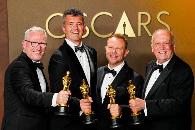 Richard Baneham, Joe Letteri, Daniel Barrertt, and Eric Saindon celebrate in the press photo room after winning the Best Visual Effects Oscar for Avatar: Fire and Ash during the 98th annual Academy Awards in the Hollywood section of Los Angeles on Sunday, March 15, 2026.  LAP20260315375 BONNIExCASH