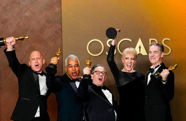 Gareth John, Al Nelson, Gwendolyn Yates Whittle, Gary A. Rizzo, and Juan Peralta celebrate in the press photo room after winning the Best Sound Oscar for F1 during the 98th annual Academy Awards in the Hollywood section of Los Angeles on Sunday, March 15, 2026.  LAP20260315384 BONNIExCASH