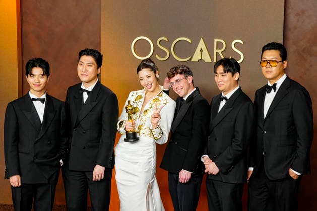 EJAE, Mark Sonnenblick, Joong Gyu Kwak, Yu Han Lee, Hee Dong Nam, Jeong Hoon Seo, and Teddy Park celebrate in the press photo room after winning the Best Original Song Oscar for Golden from KPop Demon Hunters during the 98th annual Academy Awards in the Hollywood section of Los Angeles on Sunday, March 15, 2026.  LAP20260315395 BONNIExCASH
