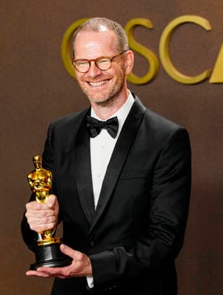 Joachim Trier celebrates in the press photo room after winning the Best International Feature Film Oscar for Sentimental Value-Norway during the 98th annual Academy Awards in the Hollywood section of Los Angeles on Sunday, March 15, 2026.  LAP20260315400 BONNIExCASH