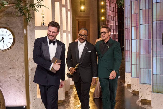 March 15, 2026, Hollywood, California, USA: Chris Evans, Ryan Coogler and Robert Downey Jr. exit the stage after presenting the Oscar for Adapted Screenplay to Paul Thomas Anderson during the 98th Oscars at the Dolby Theatre at Ovation Hollywood on Sunday. Hollywood USA  - ZUMAz03_ 20260315_zah_z03_066 Copyright: xAlxSeibx