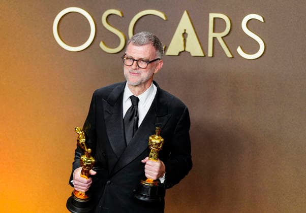 Paul Thomas Anderson celebrates in the press photo room after winning multiple Oscars including the Best Picture Award for One Battle After Another during the 98th annual Academy Awards in the Hollywood section of Los Angeles on Sunday, March 15, 2026.  LAP2026031540825 BONNIExCASH