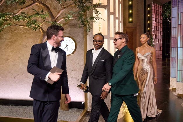 Chris Evans, Ryan Coogler and Robert Downey Jr. exit the stage after presenting the OscarÂ® for Adapted Screenplay to Paul Thomas Anderson during the 98th OscarsÂ® at the DolbyÂ® Theatre at Ovation Hollywood on Sunday, March 15, 2026. Los Angeles CA USA  350081202PLX