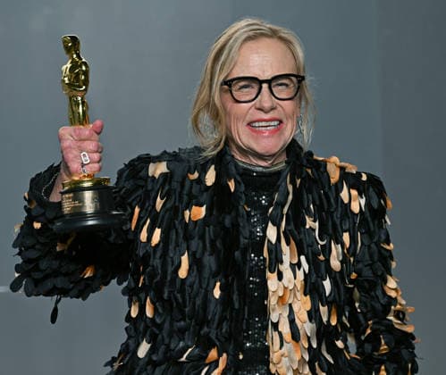Amy Madigan holds up her Best Supporting Actress Oscar as she arrives for the Vanity Fair Oscar Party at LACMA s new David Geffen Galleries in Los Angeles, California on Sunday, March 15, 2026.  LAP202603157030 CHRISxCHEW