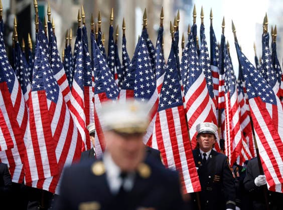 Men in uniform march on the parade route carrying American Flags at the St. Patrick s Day Parade on Fifth Avenue in New York City on Thursday, March 17, 2026.  NYP20260317119 JohnxAngelillo
