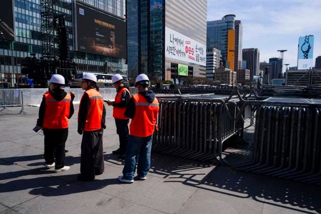 March 19, 2026, Seoul, South Korea: Construction workers stand by metal fences at the venue for the comeback concert of the K-pop boy band BTS in Gwanghwamun Square on Thursday, March 19, 2026 in Seoul, South Korea. All seven members of BTS, which has been on hiatus since 2022 due to compulsory military service, are returning in a free concert on March 21, 2026 for their upcoming new album ARIRANG. Seoul South Korea - ZUMAh163 20260319_znp_h163_009 Copyright: xJintakxHanx