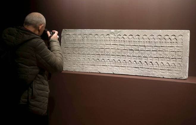 March 19, 2026, New York, New York, USA: A photographer takes a photo of an Impressed Gray Pottery Tomb Tile, Western Han Dynasty, estimate $5000 - $7,000, seen on display during the press preview for Sotheby s New York Inaugural Asian Art Sales, the first ever held at the Breuer Building. New York USA  - ZUMAk03_ 20260319_zaf_k03_006 Copyright: xNancyxKaszermanx