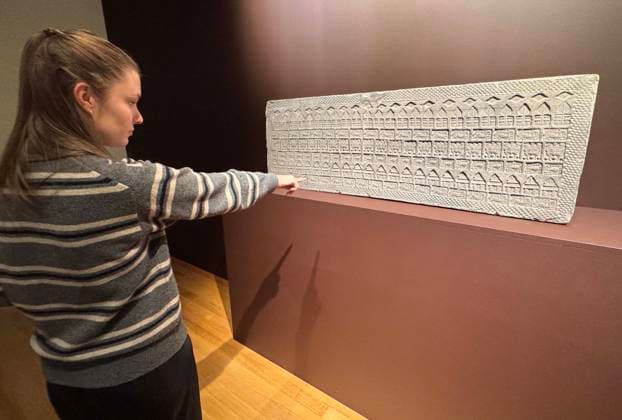 March 19, 2026, New York, New York, USA: A woman views an Impressed Gray Pottery Tomb Tile, Western Han Dynasty, estimate $5000 - $7,000, seen on display during the press preview for Sotheby s New York Inaugural Asian Art Sales, the first ever held at the Breuer Building. New York USA - ZUMAk03_ 20260319_zaf_k03_018 Copyright: xNancyxKaszermanx