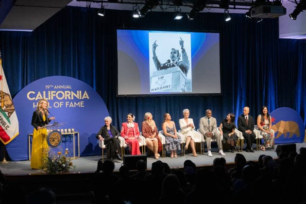 March 19, 2026, Sacramento, Ca, USA: A photo of John L. Burton, who recently passed away, is shown on the screen as First Partner Jennifer Siebel Newsom introduces him during the induction of the 19th class to the California Hall of Fame at the California Museum on Thursday, March 19, 2026, in Sacramento. Sacramento USA - ZUMAj89_ 20260319_zaf_j89_004 Copyright: xPaulxKitagakixJr.x