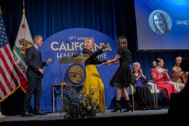 March 19, 2026, Sacramento, Ca, USA: Gov. Gavin Newsom watches as First Partner Jennifer Siebel Newsom greets Olympic swimmer Janet Evans during the induction of the 19th class to the California Hall of Fame at the California Museum on Thursday, March 19, 2026, in Sacramento. Sacramento USA - ZUMAj89_ 20260319_zaf_j89_003 Copyright: xPaulxKitagakixJr.x