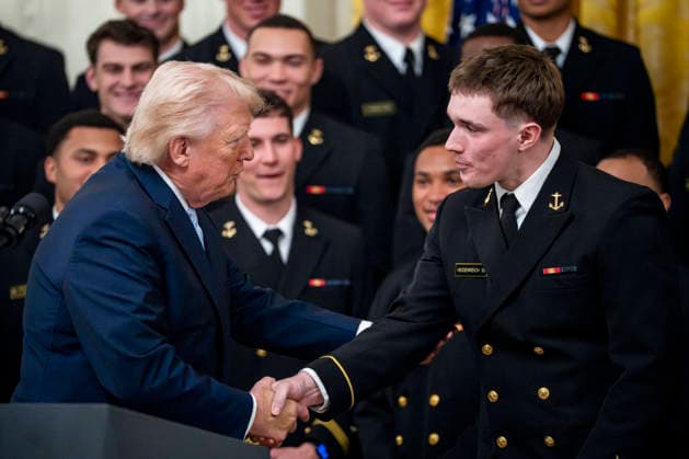 President Donald Trump greets Navy Midshipmen wide receiver Eli Heindenreich during the Commander in Chief s Trophy ceremony in the East Room of the White House in Washington, DC on Friday, March 20, 2026. The award is presented annually to the winner of the football competition between the Navy, Air Force and Army. Navy has won the trophy back to back years and 13 times over the last 23 years.  WAP202603201157 BONNIExCASH