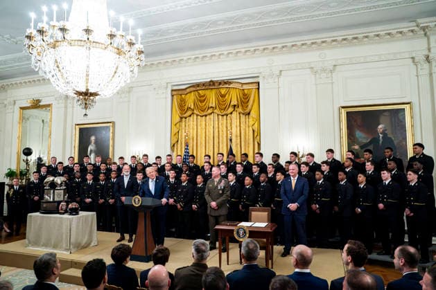 President Donald Trump presents the Commander in Chief s Trophy to the Navy Midshipmen football team during a ceremony in the East Room of the White House in Washington, DC on Friday, March 20, 2026. The award is presented annually to the winner of the football competition between the Navy, Air Force and Army. Navy has won the trophy back to back years and 13 times over the last 23 years.  WAP202603201169 BONNIExCASH