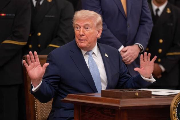 March 20, 2026, Washington, District Of Columbia, USA: President DONALD TRUMP signs an executive order to reserve a four hour block on the second Saturday in December for the Army Navy football game during an event in the East Room of the White House Washington USA - ZUMAs365 20260320_znp_s365_020 Copyright: xJoeyxSussmanx