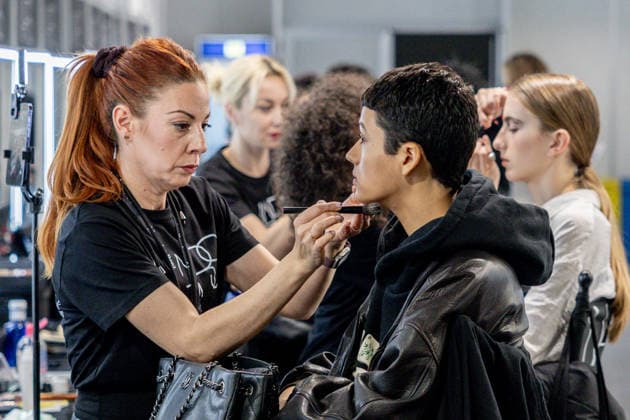 Fely Campos fashion show at Mercedes Benz Fashion Week Make-up artist applies make-up to a model backstage at Fely Campos fashion show on the occasion of Mercedes Benz Fashion Week, March 21, 2026, in Madrid Spain Fely Campo is a firm that stands out for the precision of its patterns and its refined style Its fashion show is part of the Mercedes Benz Fashion Week Madrid, the main Spanish fashion show organized by IFEMA, which brings together established firms and new talent MARCH 21, 2026 FASHION Madrid Madrid Spain  Copyright: xRicardoxRubiox 7384960