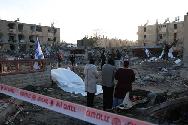 Iranian retaliatory strikes leave extensive destruction in Israeli city of Dimona DIMONA, ISRAEL - MARCH 22: A view of the damaged area following an overnight Iranian retaliatory missile strike left extensive destruction in Dimona, Israel on March 22, 2026. Direct missile strikes severely damaged several residential buildings, leaving debris scattered across affected neighborhoods as residents assessed the destruction. Saeed Qaq Anadolu Dimona Israel. Editorial use only. Please get in touch for any other usage.  Copyright: x2026xAnadoluxSaeedxQaqx