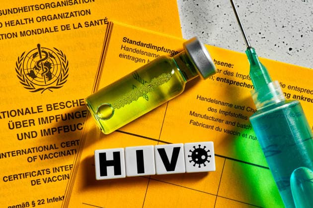 Dachau, Bavaria, Germany March 22, 2026: PHOTOMONTAGE. The letters HIV? superimposed over a vaccination card, a vaccine, and a syringe symbolize global research into an HIV vaccine. Despite advances in treatment and prevention, developing effective protection remains a key challenge. *** FOTOMONTAGE, Der Schriftzug HIV vor Impfausweis, Impfstoff und Spritze symbolisiert die weltweite Forschung an einem HIV-Impfstoff. Trotz Fortschritten in Therapie und Prävention bleibt die Entwicklung eines wirksamen Schutzes eine zentrale Herausforderung.