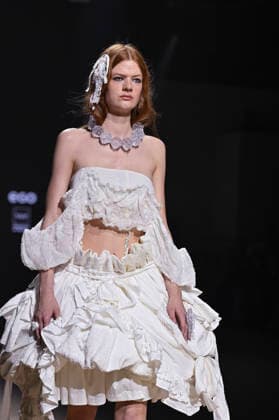 Mercedes-Benz Fashion Week Madrid in Spain - 22 Mar 2026 A model walks the runway wearing a design by Mericusan during Mercedes-Benz Fashion Week de Madrid in IFEMA. Madrid Spain Copyright: xAtilanoxGarciax xSOPAxImagesx photos10237