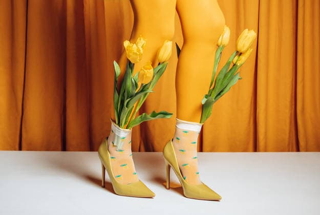Yellow tulips in high heels with sheer socks on colorful background model released, Symbolfoto, AAF00482