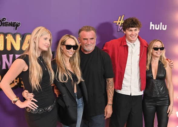 Hannah Montana 20th Anniversary Special LOS ANGELES, CALIFORNIA - MARCH 23 Maxx Morando, Miley Cyrus, Tish Cyrus, Dominic Purcell, Brandi Cyrus and Joshua Purcelll at the World Premiere of Disney+ s Hannah Montana 20th Anniversary Special at El Capitan Theatre on March 23, 2026 in Los Angeles, California.Credit: Michael Mattesr AdMedia EDITORIAL USE ONLY  Copyright: xx AdMediax admphotostwo977109