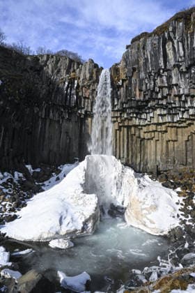 Creative Highlights World Nature’s Geological Archive: Iceland ICELAND – MARCH 11: A waterfall flows over basalt columns into a partially frozen pool in Iceland on March 11, 2026. Iceland, located along the boundary between the Eurasian and North American tectonic plates and often described as the Land of Fire and Ice, attracts thousands of tourists each year. The island nation in the North Atlantic stands out for its dynamic landscape shaped by intense volcanic activity and glacial formations, offering opportunities for both scientific research and nature tourism. Aytug Can Sencar Anadolu Vik Iceland. Editorial use only. Please get in touch for any other usage.  Copyright: x2026xAnadoluxAytuÄüxCanxSencarx