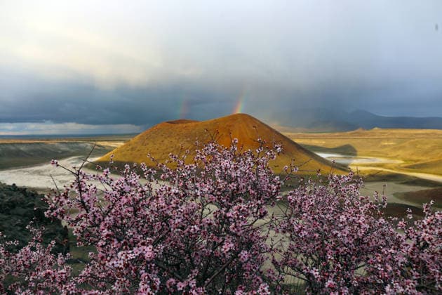 Creative Highlights World Spring season in Turkiye s Meke Crater Lake KONYA, TURKIYE - MARCH 22: The Meke Crater Lake, known as the evil eye bead of the world is seen alongside blooming trees and a rainbow in the Karapinar district of Konya, Turkiye, on March 22, 2026. Yavuz Gorur Anadolu Konya Turkey. Editorial use only. Please get in touch for any other usage.  Copyright: x2026xAnadoluxYavuzxGorurx