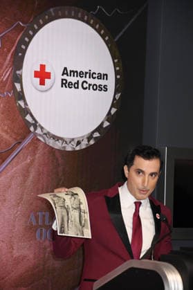 NEW YORK,NY - MARCH 24: Alejandro Condis, showing a photo of his grandfather in the Red Cross in Cuba, lights the Empire State Building in Honor of Red Cross Giving Day in New York City on March 24, 2026. Copyright: xmpi099 MediaPunchx
