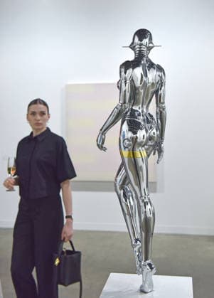 (260326) -- HONG KONG, March 26, 2026 -- A visitor views an exhibit at the preview of Art Basel Hong Kong 2026 at the Hong Kong Convention and Exhibition Center in south China s Hong Kong, March 25, 2026. Art Basel Hong Kong 2026 held its preview here on Wednesday, bringing together 240 galleries from 41 countries and regions. Featuring six themed sectors and programs, the fair will open to the public from Friday to Sunday. ) CHINA-HONG KONG-ART BASEL-PREVIEW (CN) ChenxDuo 