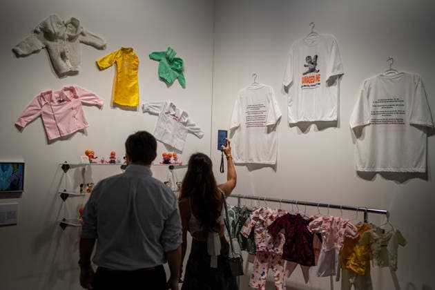 HONGKONG-ART ART-BASEL People viewing cloths hanging on the wall at Art Basel 2026 in Hong Kong, March 26, 2026. NEXPHER Vernon Yuen HONG KONG