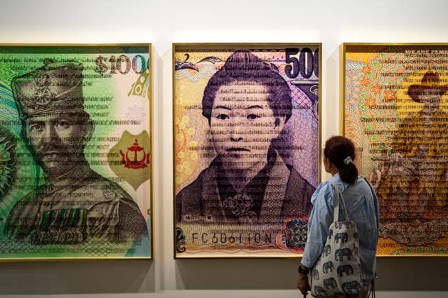 HONGKONG-ART ART-BASEL A woman looking at art displays handing on the wall at Art Basel 2026 in Hong Kong, March 26, 2026. NEXPHER Vernon Yuen HONG KONG