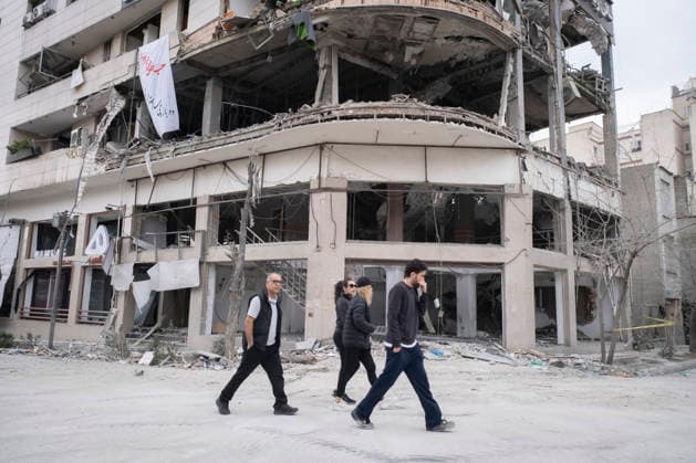 U.S.-Israeli Military Campaign In Iran Iranian residents walk past a commercial-office building housing the Qatari Al-Araby TV office, which was struck during U.S.-Israeli military operations, in a residential area of Tehran, Iran, on March 29, 2026. Tehran Tehran Iran  Copyright: xMortezaxNikoubazlx originalFilename: nikoubazl-usisrael260329_npB61.jpg