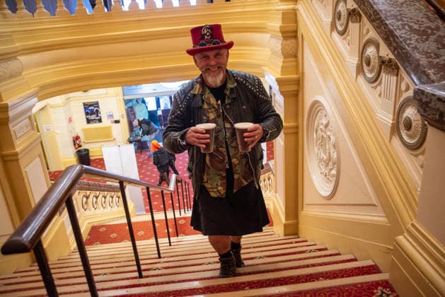 Scarborough Punk Festival 2026, UK - 29 Mar 2026 A punk rock fan carries some beers up to the balcony to enjoy the next gig on the festival in Scarborough. Hundreds of punk rock fans gathered in Scarborough Spa in Yorkshire county, England for the two days long punk rock festival. Scarborough United Kingdom Copyright: xKrisztianxElekx xSOPAxImagesx SSS_20260329_PUNK_FEST_0011005241
