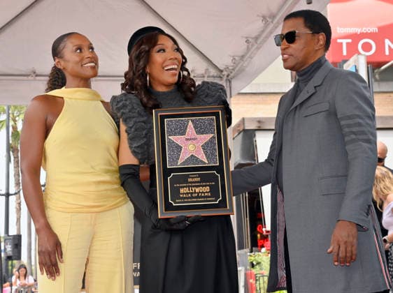 Singer, songwriter and actress Brandy (C) is joined by actress Issa Rae (L) and singer Babyface during an unveiling ceremony honoring her with the 2,839th star on the Hollywood Walk of Fame in Los Angeles on Monday, March 30, 2026.  LAP2026033007 JIMxRUYMEN