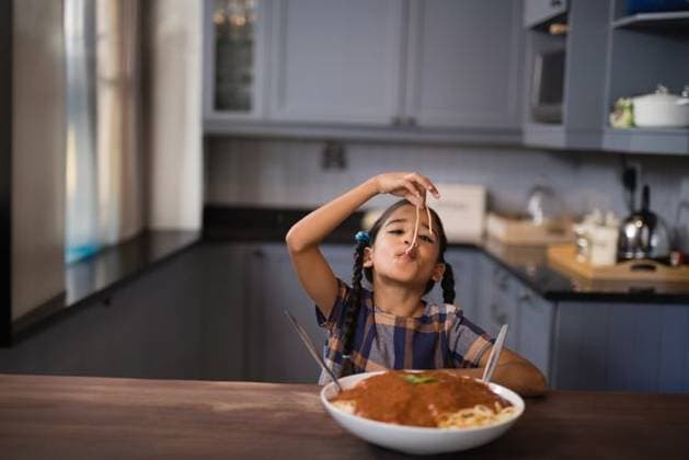 Young girl enjoying spaghetti at home, playfully eating with big smile, copy space Young girl enjoying spaghetti at home, playfully eating with big smile, copy space. Childhood, pasta, happiness, dining, mealtime, model released, , property released, , 15.03.2017, 5846451.jpg, people,girl,spaghetti,home,happiness,dining,mealtime,child,pasta,joy,copy space,meal,family,food,laughter,playful,cheerful,eating,plate,fork,noodles,sauce,kitchen,table,fun,smile,bonding,togetherness,childhood,snack,delicious,cuisine,nutrition,dinner,homemade,recipe,comfort,enjoyment,vibrant,colorful,atmosphere,celebration,wholesome,activity,leisure,experience,delight,taste,flavor Child,Girl,Female,Mixed-Race