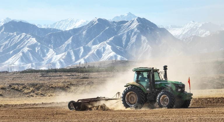 Wheat Planting ZHANGYE, CHINA - APRIL 1, 2026 - Farmers are using a planting machine that integrates sowing, fertilizing, mulching, and drip irrigation with a Beidou navigation autonomous driving tractor for shallow buried drip irrigation wheat planting at Jinhuazhai Wheat Planting Base in Zhangye City, Gansu Province, China on April 1, 2026. Zhangye Gansu China  Copyright: xCFOTOx i1775061892941