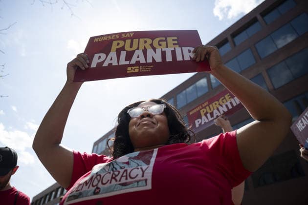 Anti-ICE demonstrators protest Palantir in Washington, DC WASHINGTON, DC - UNITED STATES - APRIL 01: A group of anti-ICE demonstrators hold a rally in front of the Palantir headquarters to protest the company in Washington, DC, United States on April 01, 2026. Celal Gunes Anadolu Washington United States. Editorial use only. Please get in touch for any other usage.  Copyright: x2026xAnadoluxCelalxGunesx