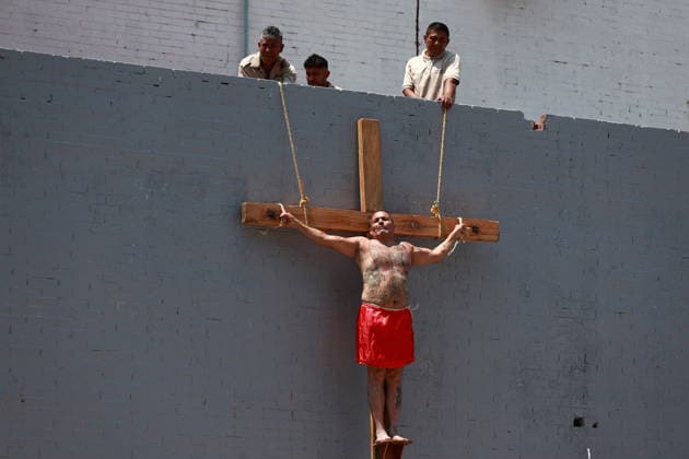 Inmates perform Via Crucis inside prison during Holy Week in Mexico City MEXICO CITY, MEXICO - APRIL 03: An inmate performs the Via Crucis while other inmates steady the cross with ropes in one of the yards of the Reclusorio Preventino Varonil Oriente, a men s prison in Mexico City, Mexico on April 03, 2026. Dozens of inmates participate in the Via Crucis following months of preparation as part of a social reintegration program during Holy Week. Daniel Cardenas Anadolu Mexico City Mexico. Editorial use only. Please get in touch for any other usage.  Copyright: x2026xAnadoluxDanielxCardenasx
