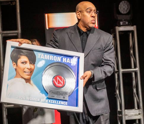 April 4, 2026, Philadelphia, Pennsylvania, United States: DERRICK CORBETT, Senior Vice President of Programming for iHeartMedia holds an award to present to TAMRON HALL, American broadcast journalist, television talk show host and author, receives the WDAS-FM tenth annual Women Of Excellence Legend award at the luncheon held at the Philadelphia Sheraton Philadelphia United States - ZUMArf1_ 20260404_zaf_rf1_026 Copyright: xRickyxFitchettx