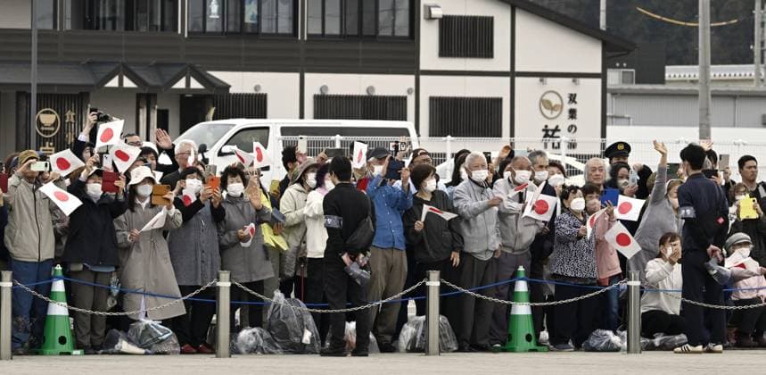 Japan imperial family s trip to Fukushima People wave to Japan s Emperor Naruhito, Empress Masako and their daughter Princess Aiko upon their arrival at the Great East Japan Earthquake and Nuclear Disaster Memorial Museum in Futaba, a Fukushima Prefecture town that co-hosts the crippled Fukushima Daiichi nuclear power plant, on April 6, 2026. Fifteen years after the earthquake, tsunami and nuclear disasters that struck northeastern Japan in March 2011, they are visiting the prefecture to see the recovery efforts firsthand.  A14AA0005440274P