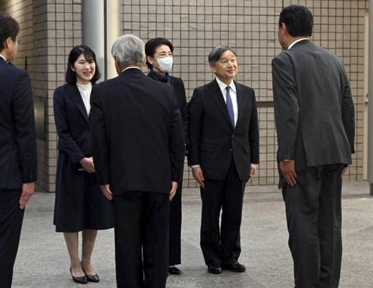 Japan imperial family s trip to Fukushima Japan s Emperor Naruhito (back, R), Empress Masako (back, C) and their daughter Princess Aiko are greeted upon their arrival on April 6, 2026, at the J-Village football training center in Naraha, Fukushima Prefecture, which served as a relief center for people affected by the Great East Japan Earthquake. Fifteen years after the earthquake, tsunami and nuclear disasters that struck northeastern Japan in March 2011, they are visiting the prefecture to see the recovery efforts firsthand. (Pool photo)  A14AA0005440275P