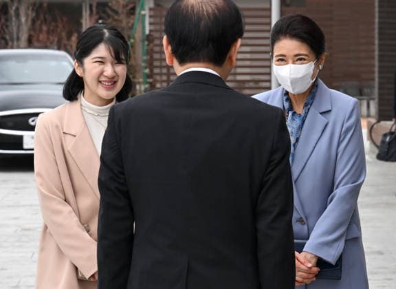 Japan imperial family s trip to Fukushima Japanese Empress Masako and her daughter Princess Aiko are greeted upon their arrival at the Linkru Okuma communication facility in Okuma, Fukushima Prefecture on April 7, 2026. Emperor Naruhito, the empress and the princess are visiting Fukushima Prefecture to observe the recovery efforts after a massive earthquake and tsunami struck the region in March 2011, triggering a nuclear accident at the Fukushima Daiichi power plant. (Pool photo)  A14AA0005440891P