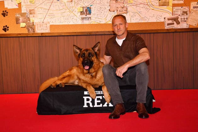 Maximilian Brueckner and german shepherd Rex arrive at the Kommissar Rex Season Premiere at Astor Film Lounge on April 8, 2026 in Munich, Germany Kommissar Rex Season Premiere in Munich, Germany