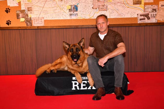 Maximilian Brueckner and german shepherd Rex arrive at the Kommissar Rex Season Premiere at Astor Film Lounge on April 8, 2026 in Munich, Germany Kommissar Rex Season Premiere in Munich, Germany