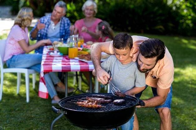 Father teaching son cooking on barbecue with family Father teaching son cooking on barbecue with family in background, model released, , property released, Cape Town, South Africa, 26.01.2016, 717137.jpg, mother, father, son, daughter, enjoying, relaxing, leisure, spare time, free time, activities, time off, together, childhood, smiling, happiness, bonding, love, cute, casual, lifestyle, kid, summer, fun, playful, multi-generation family, grandmother, grandfather, grandson, granddaughter, granny, granddad, relaxation, meal, food and drink, barbecue, grilling, barbecue grill, holding, breakfast, retirement, golden years 50s, Mature Adult, Man, Male, Caucasian, 60s, Senior, Elderly, 20s, Young Adult, Child, Girl, Female, Boy, 30s, Mid Adult