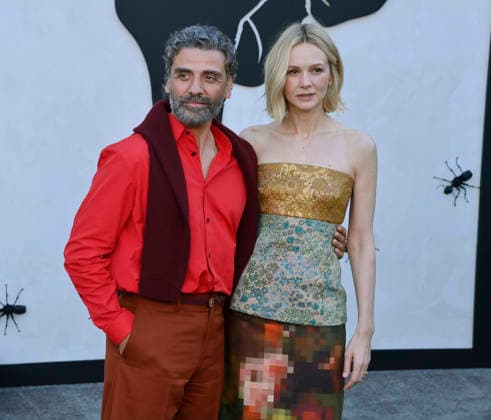Cast members Oscar Isaac and Carey Mulligan (R) attend Netflix s dark comedy TV series Beef at the Egyptian Theatre in the Hollywood section of Los Angeles on Wednesday, April 8, 2026. Storyline: Road rage ensues after a parking-lot incident, resulting in a bitter feud between the two antagonists. The vendetta between them and the lengths they ll go to in order to wreak revenge on each other spirals out of control, jeopardizing everything and everyone in their lives.  LAP2026040813 JIMxRUYMEN